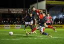 Alex Newby scores the sixth goal for Altrincham as they run amok against York City on Tuesday night. Picture by Jonathan Moore