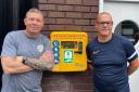 Left to right: Sean Salinger and Darren Storey with the defibrillator