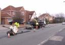 Council workmen repair potholes on Cherry Lane, Sale