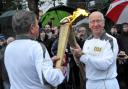 Thousands welcome the Olympic torch