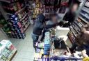 A robber with a gun threatens staff at Bargain Booze in Ramsbottom