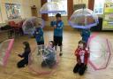 Rainbows and Beavers practising for Singing in the Rain