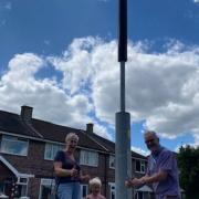 Cllrs Sue Maitland and Barry Winstanley with one of the new lampposts