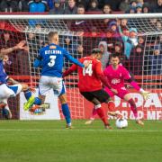 Oldham’s Liam Hogan deflects Dior Angus’ shot on to the bar during Saturday’s FA Cup tie. Picture by Jonathan Moore