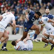 Sale Sharks' Manu Tuilagi avoids being tackled by Exeter Chiefs' Harvey Skinner (floor) on Sunday
