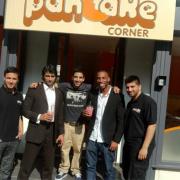 Iftikhar Khan, Duane Bryan and Azhar Siddique with staff from Pancake Corner