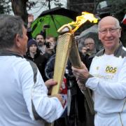 Thousands welcome the Olympic torch