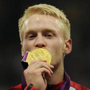 Jonnie Peacock with his 100m gold medal