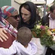 New Zealand’s Prime Minister Jacinda Ardern hugs and consoles a woman as she visited Kilbirnie Mosque to lay flowers