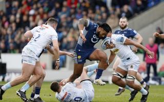 Sale Sharks' Manu Tuilagi avoids being tackled by Exeter Chiefs' Harvey Skinner (floor) on Sunday