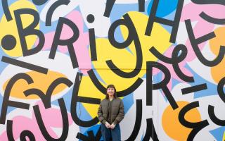 Caroline Dowsett in front of the Bright Futures art work