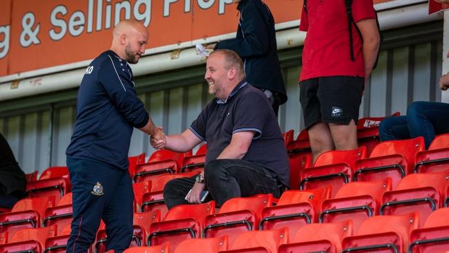 Robins boss Phil Parkinson, with the late Altrincham super-fan Mark Eckersall