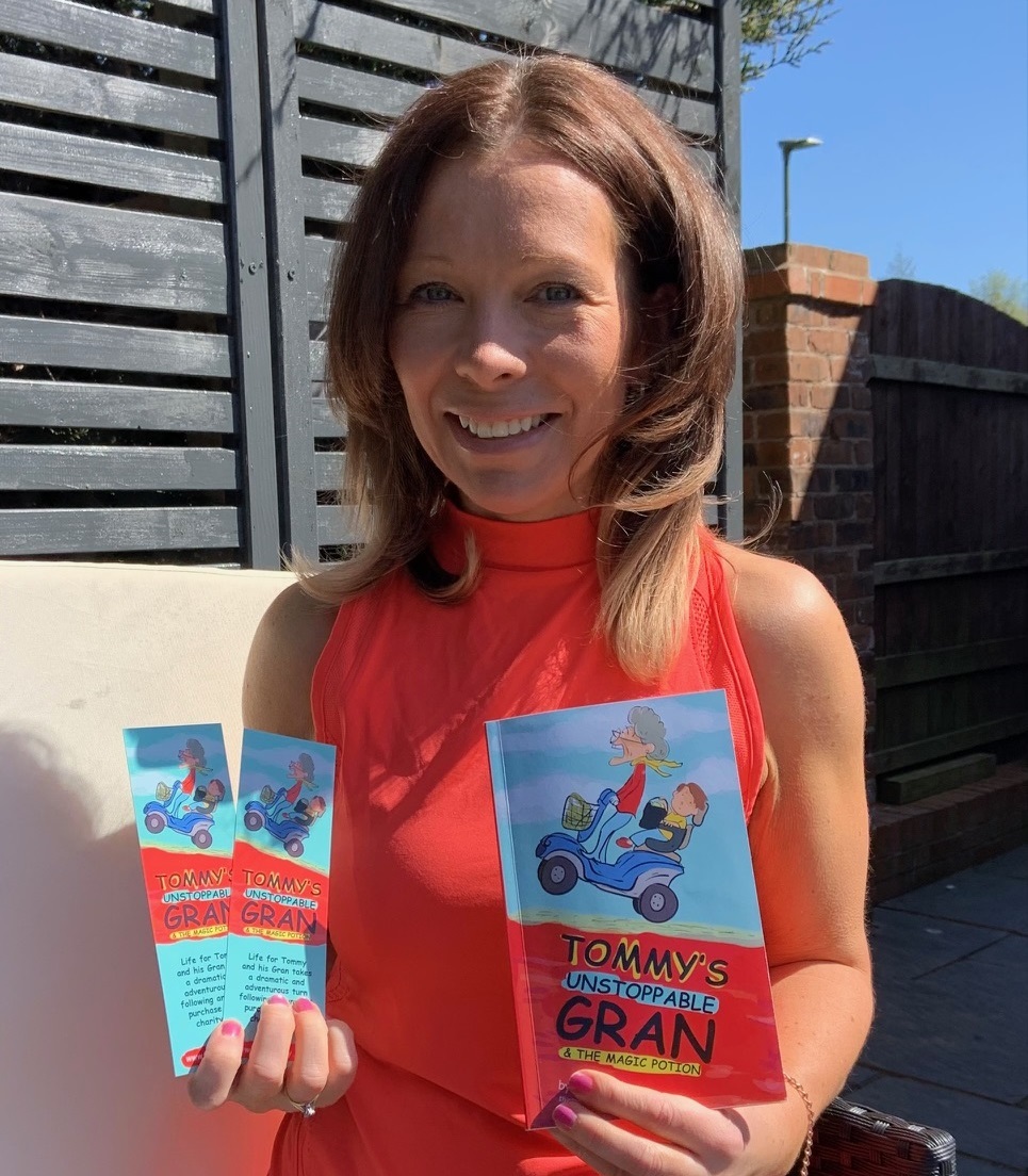 Leanne Rieveley with copies of her book