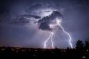 Lightning strikes from a cloud during a thunderstorm above the city of Goerlitz, eastern Germany early Sunday, Aug. 4, 2013. (AP Photo/dpa, Florian Gaertner).