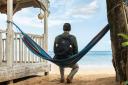 For use in UK, Ireland or Benelux countries only ..Undated BBC handout photo of a teaser showing the rear view of the new Detective Inspector from Death In Paradise who will replace Ardal O'Hanlon's DI Jack Mooney when he departs the detective dra