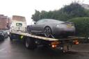 An Aston Martin has been recovered after 'causing an obstruction'