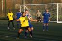 Action from Urmston Town's clash with Bury Amateurs (blue)