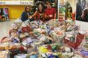 Staff with the hampers created through 'Winter Warmers' prioject