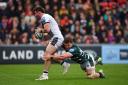 HALTED: Sale Sharks' Tom Curry is tackled by Leicester Tigers' Jasper Wiese