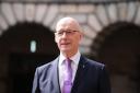 John Swinney was sworn in as First Minister on May 8 (Andrew Milligan/PA)