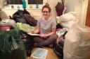 Francesca Fox sorting her donations