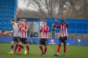 Altrincham players applaud the travelling fans at Curzon Ashton after their 6-0 win. Picture by Michael Ripley Photography