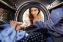 A Generic Photo of a woman reaching into the inside of a tumble dryer. See PA Feature TOPICAL Tumble Dryer Fire. Picture credit should read: PA Photo/thinkstockphotos. WARNING: This picture must only be used to accompany PA Feature TOPICAL Tumble Dryer Fi