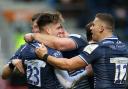 SEVENTH HEAVEN: Jack Metcalf (left) celebrates scoring Sale’s seventh try against Ospreys. Picture by Nigel French/PA Wire.