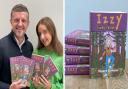 Stuart and his daughter Izzy with copies of his book