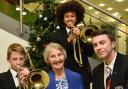 Olive Goldrick, 80, with musicians Ivan Livings and Mele Gadzuma and her great nephew Matthew Bancroft, 17,