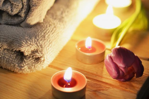 Messenger Newspapers: A pile of towels, candles and a tulip. Credit: Canva