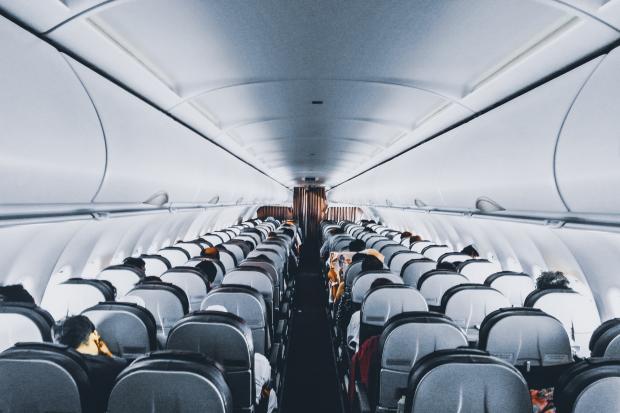 Messenger Newspapers: Rows of empty seats on a plane. Credit: Canva