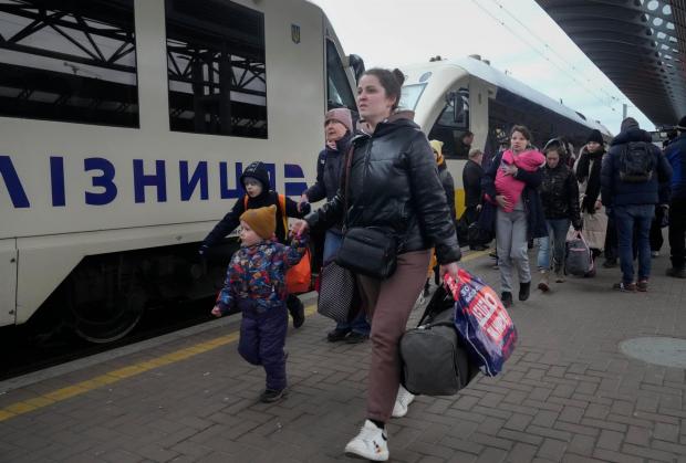 Messenger Newspapers: Ukrainian refugees at a train station.  Credit: PA