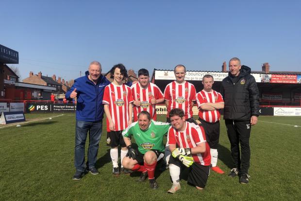 GREAT SCOT: Ally McCoist poses with Altrincham’s disability footballers during his visit last week