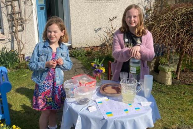 Messenger Newspapers: Christina and her little sister Hayley at their stall raising money for Newsquest's Ukraine appeal.