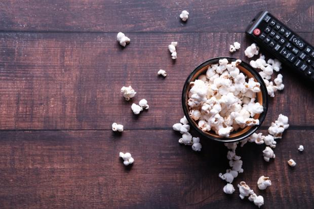 Messenger Newspapers: A bowl of popcorn and a TV remote (Canva)