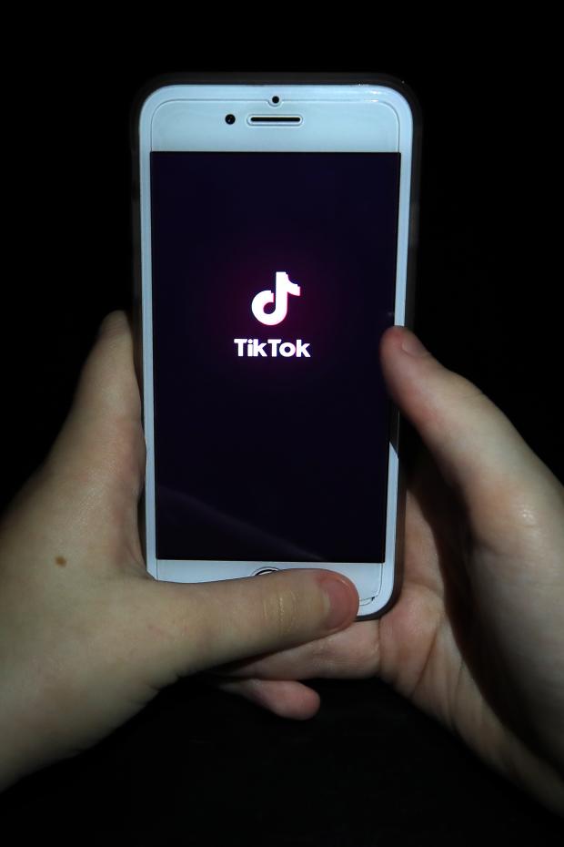 Messenger Newspapers: A person with TikTok open on their phone. Credit: PA
