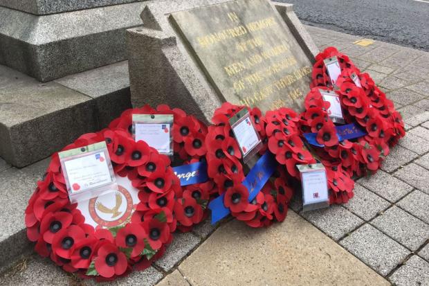 Messenger Newspapers: Wreaths on the memorial.