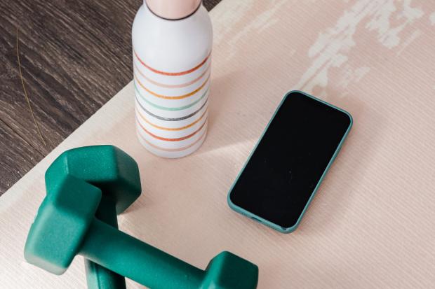 Messenger Newspapers: Dumbbells, water bottle and a phone. Credit: Canva