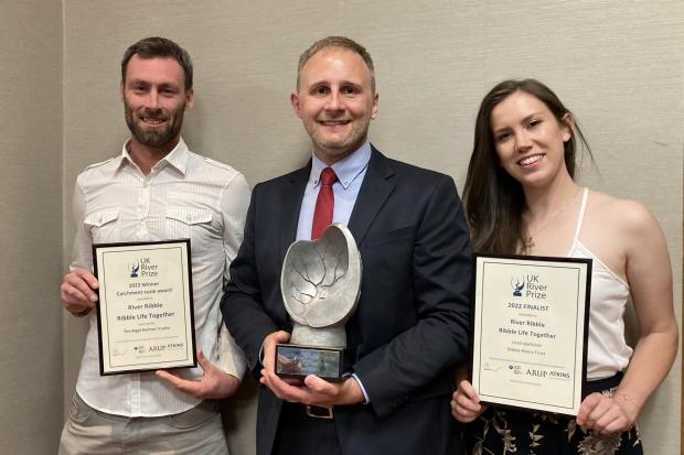 Adam Walmsley, Harvey Hamilton-Thorpe and Ellie Brown receive the UK River Prize on behalf of RRT and Ribble Life partnership