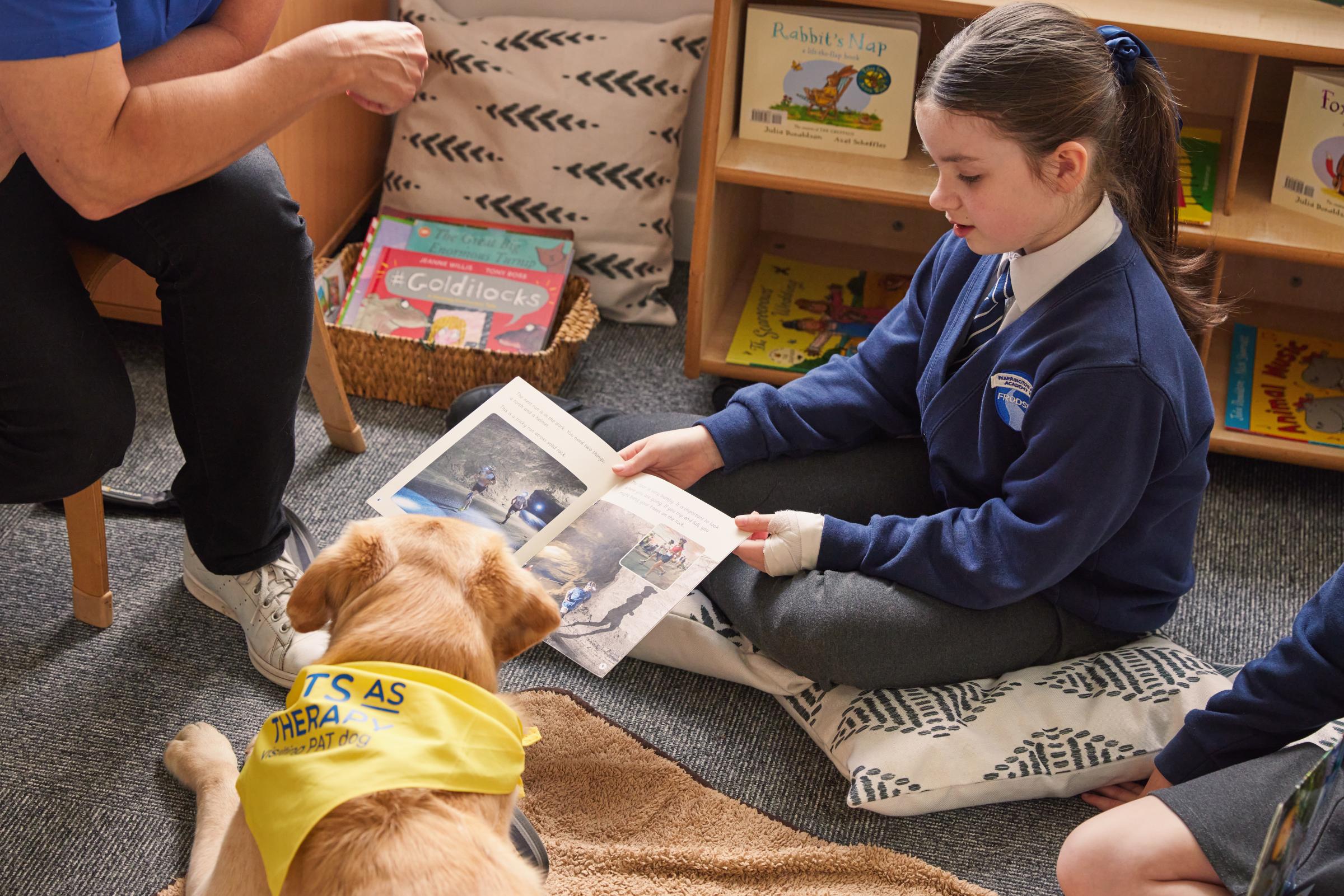 Each week, pupils of Frodsham Primary Academy are invited to read aloud to therapy dog Opal and owner Suzie Dickens.