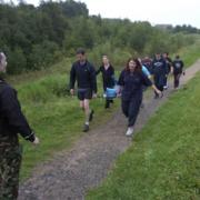 Boot Campers carry the stretcher full of sandbags