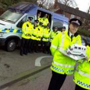 Area Insp Simon Wright and Chf Supt Janette McCormick (front) with the Copshop team