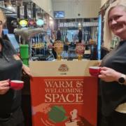 Staff members, Sam Dooley and Jane Fennicks, support 'the warm space' plan