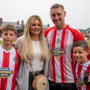 Jake Moult with his wife, Rebecca, and sons Archie, left, and Jude after his testimonial game last weekend. Picture by Jonathan Moore