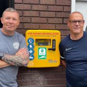 Left to right: Sean Salinger and Darren Storey with the defibrillator