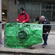 Train drivers from the Aslef union on a picket line outside Manchester Piccadilly train station