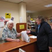 Joan Parkinson (left) working in the hospital's shop