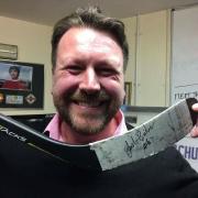 Storm owner Gordon Greig with the signed hockey stick