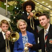 Olive Goldrick, 80, with musicians Ivan Livings and Mele Gadzuma and her great nephew Matthew Bancroft, 17,